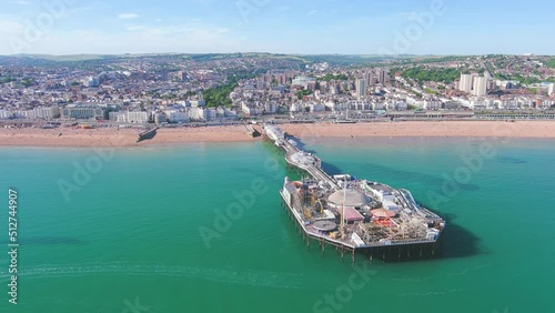 Brighton, UK: Aerial view of city in England, wide beach and blue waters of Atlantic Ocean in seaside resort in summer, sunny day with clear blue sky - landscape panorama of United Kingdom from above photo