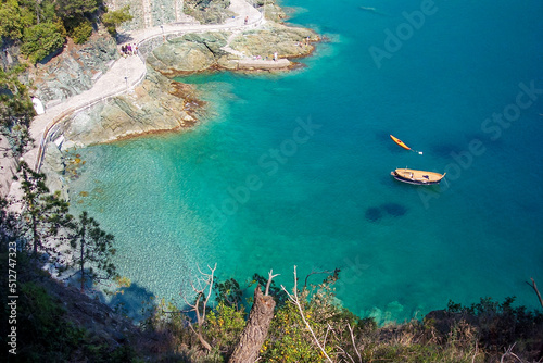 Fototapeta Naklejka Na Ścianę i Meble -  Turquoise blue sea in Liguria. Ligurian sea with boats. Ligurian coast. Aerial view  of the Bonassola seafront promenade, La Spezia, Liguria, Italy.  Panoramic view clear Ligurian sea