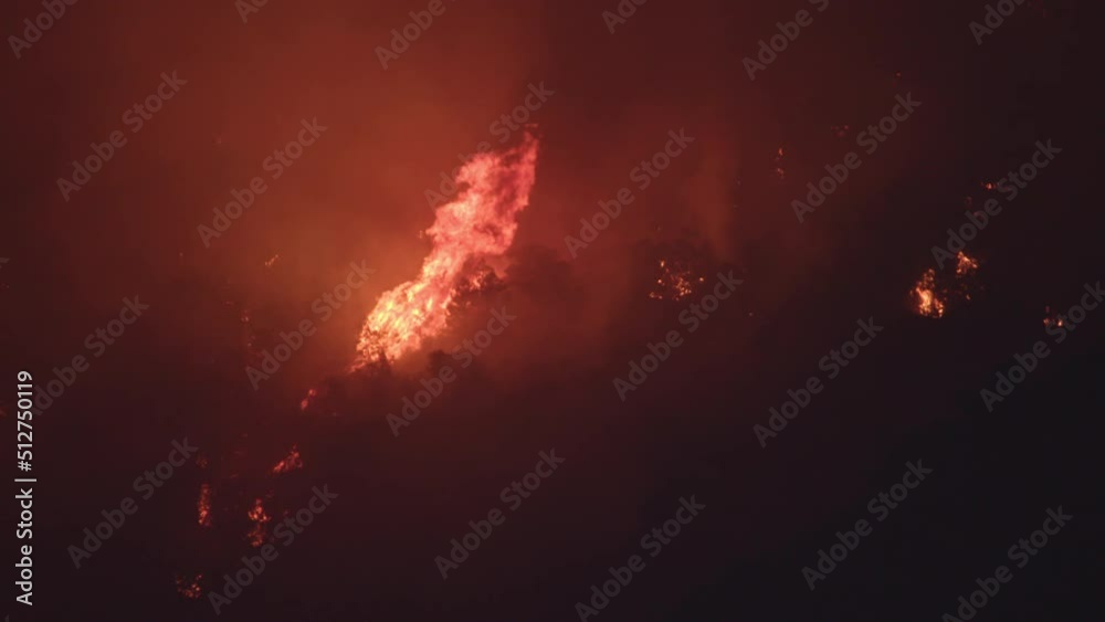 Tall flames burning down mountain side in Utah from wildfire that was human caused. Tall flames burning down mountain side in Utah from wildfire that was human caused.