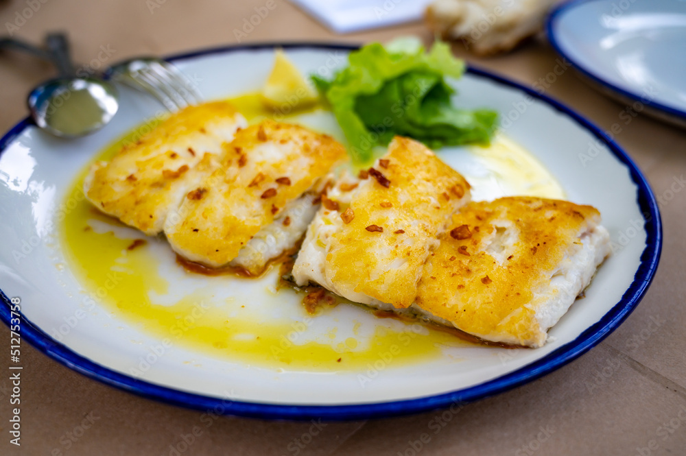 Grilled fillet of white codfish served in fish restaurant in San Sebastian, Basque Country, Spain