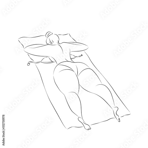 A young girl in a bathing suit is sunbathing.