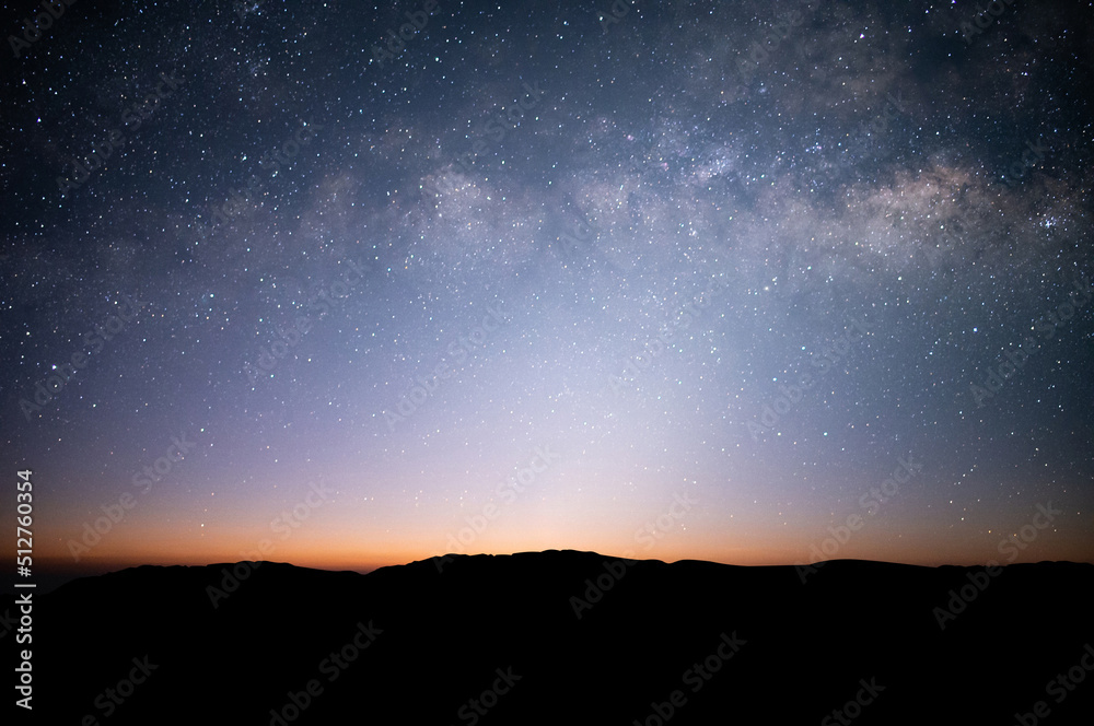 Fototapeta premium Beautiful view on top of the mountain, night sky, star and Milky Way over the sky.