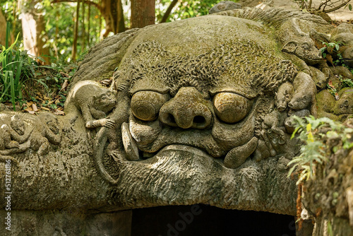 Stone statue at the entrance to Monkey forest reserve Ubud Bali Indonesia
