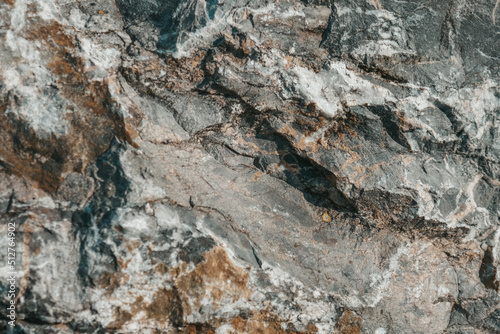 Gray stone texture background in grunge style. Mountain stones close up.