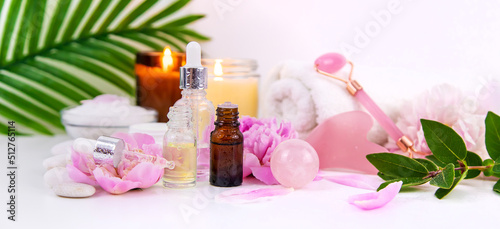 Pink flowers on white background spa facial. Selective focus.