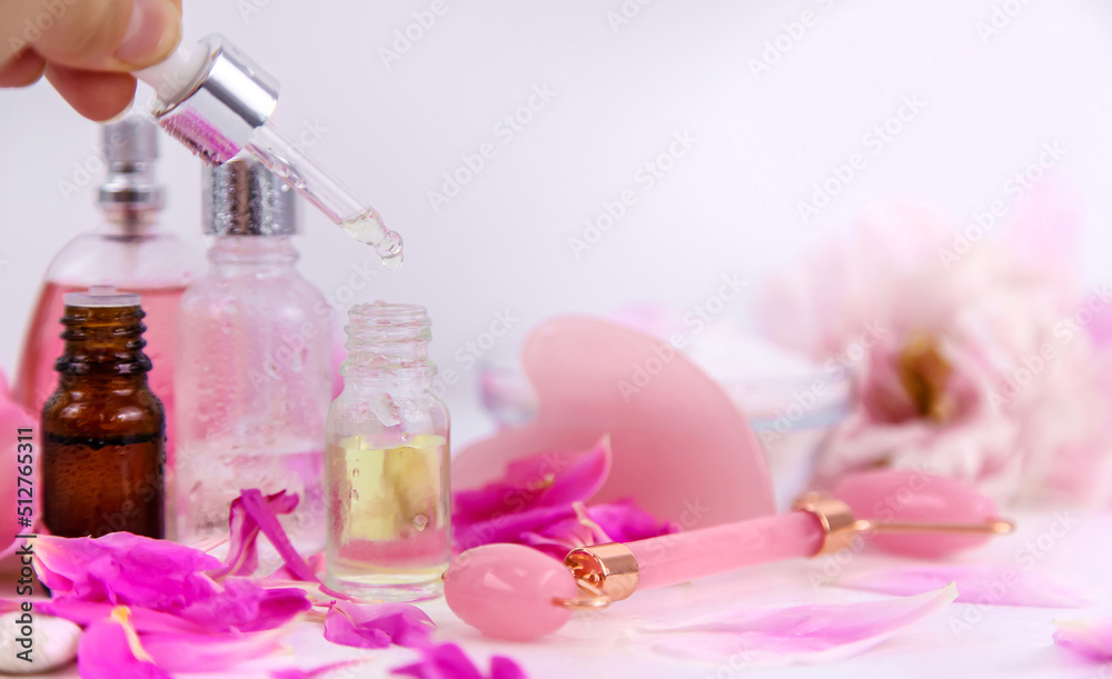 Pink flowers on white background spa facial. Selective focus.