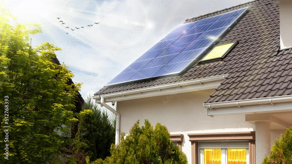 Solar panels on roof. Beautiful modern house and solar energy. Rays of sun. Visualization - video effect