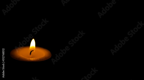 candle light against in the dark background.