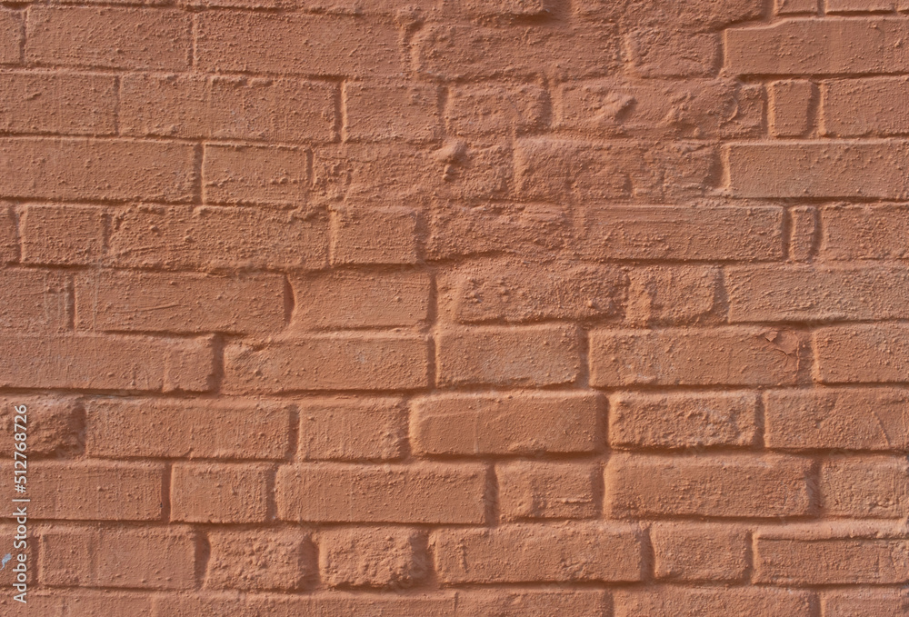 Red painted brick wall of the building Red painted brick wall of the building