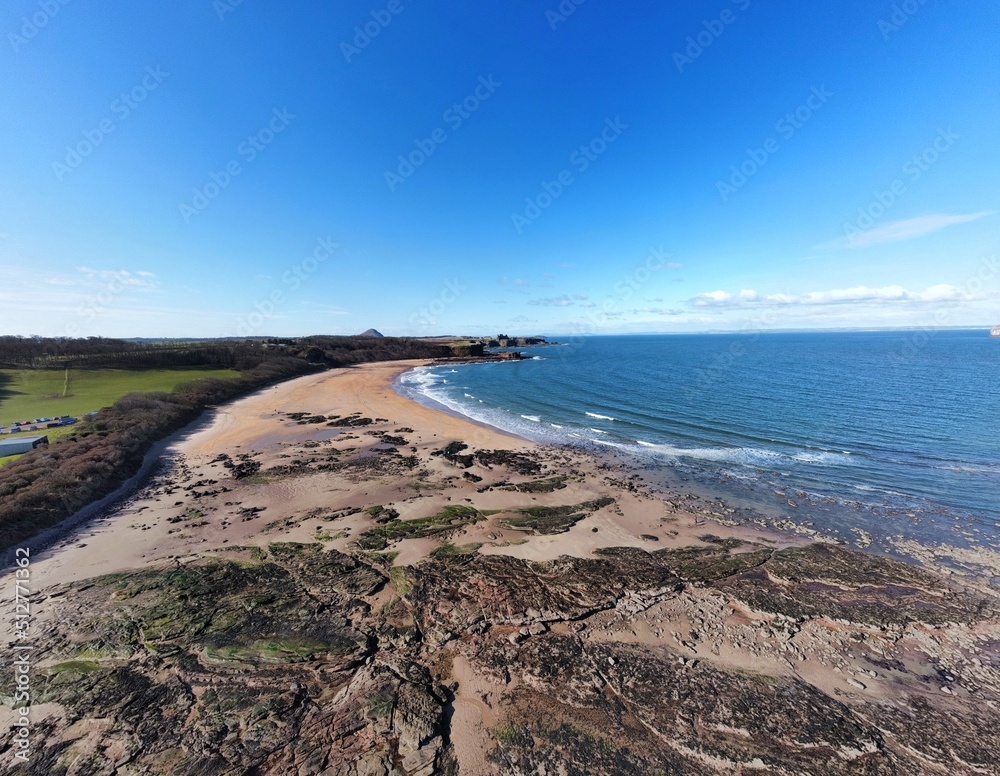 Aerial view of the sea and rocky coastline on the East coast of Scotland. 
