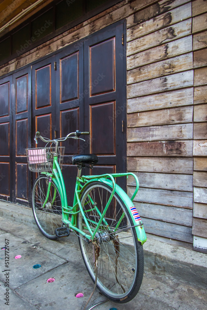 Chiang Khan,Loei,Thailand on DEC23,2018:A bicycle and old wooden house at Chiang Khan’s walking street. 