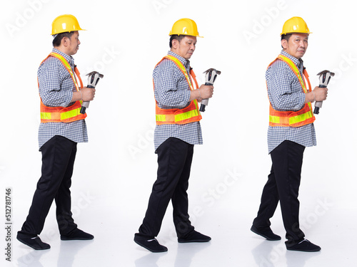 Full length 60s 50s Asian Senior man industry engineer contractor, walking forward left right © Jade
