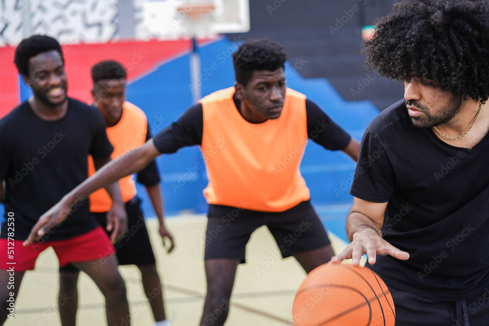 African friends playing basketball outdoor - Focus on right man face African friends playing basketball outdoor - Focus on right man face