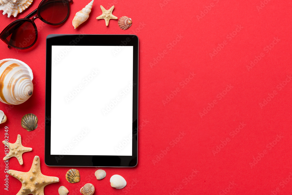 Flat lay composition with tablet and beach accessories on colored background. Tablet computer with blank screen mock up with copy space