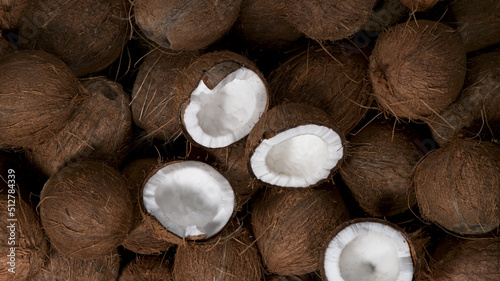 Cracked coconuts falling, freeze motion, top down view