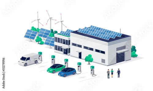 Company electric cars fleet charging on charger station at logistic hall centre. Transport delivery van and business vehicles recharging renewable solar wind electricity energy from factory building.
