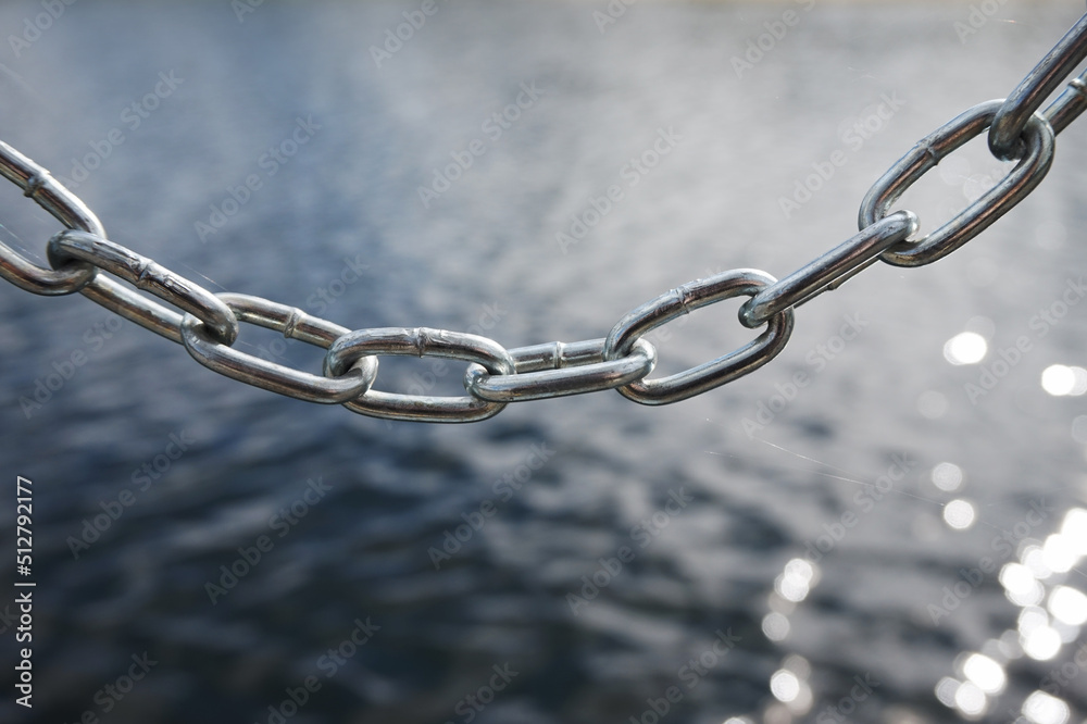 Fototapeta premium Silver metal chain, defocused background