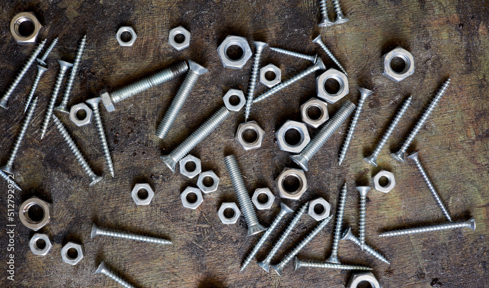 old nails screws and bolts on a background
old nails screws and bolts on a background