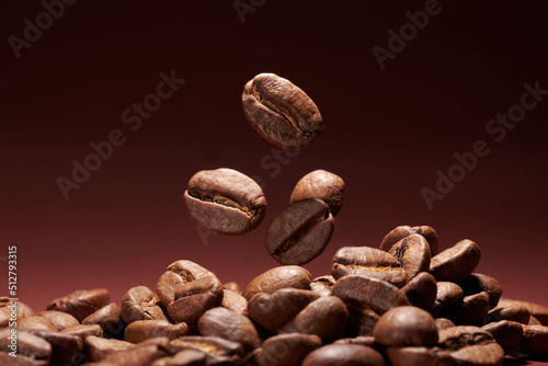 Roasted coffee beans closeup on brown gradient background