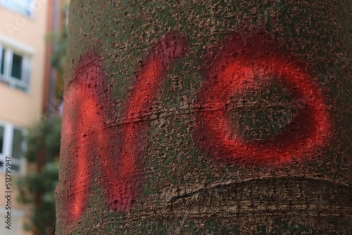 graffiti on tree '' no '' 