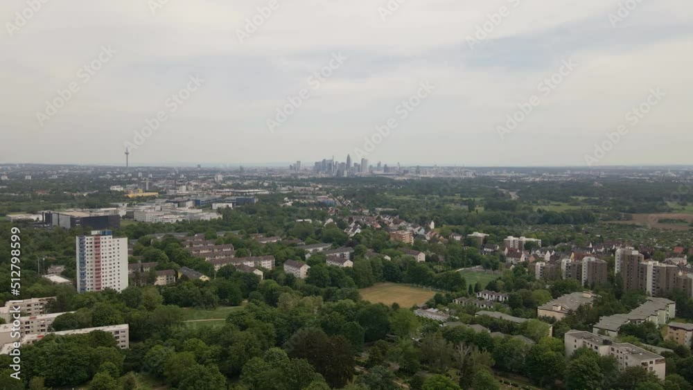 Aerial approach towards the cityscape of Frankfurt, Germany on an overcast spring day. Wide angle tracking shot Aerial approach towards the cityscape of Frankfurt, Germany on an overcast spring day. Wide angle tracking shot
