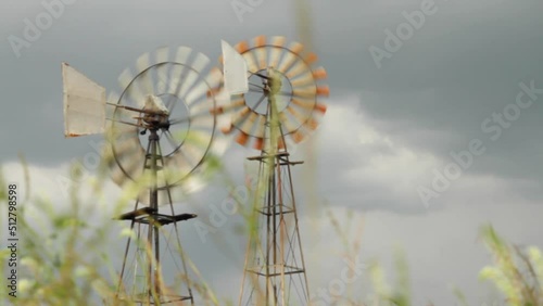 Windmills in the farm fields photo
