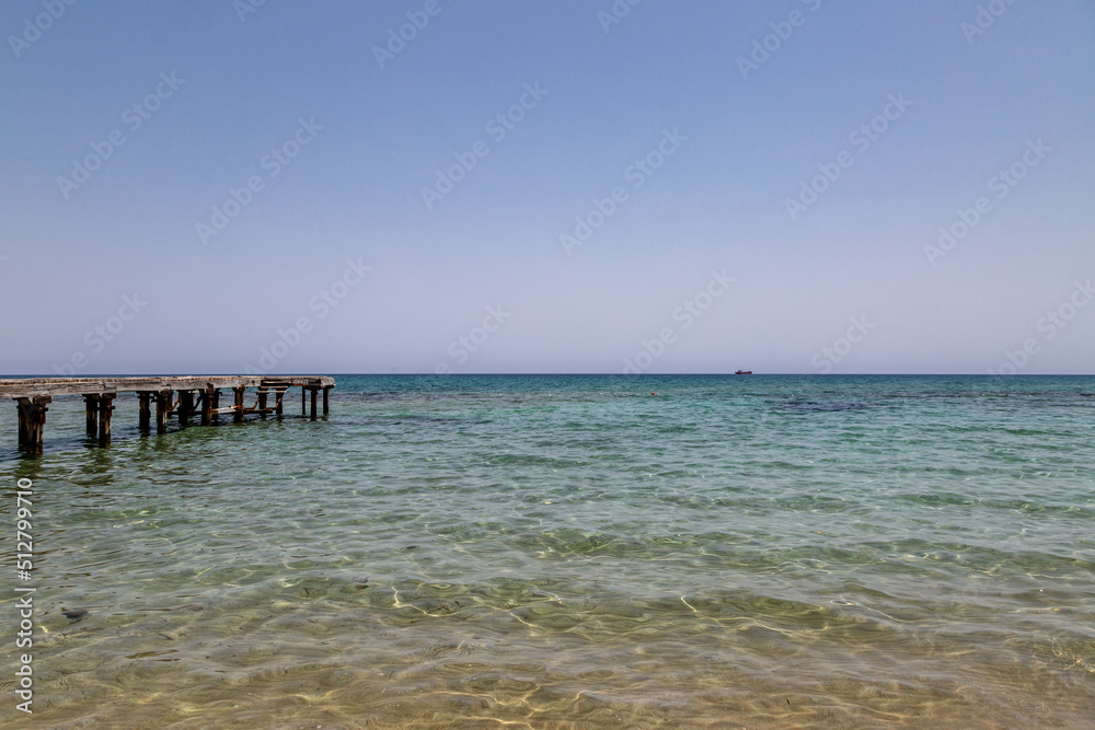 A wooden pier over the ocean, at Salamis in Northern Cyprus