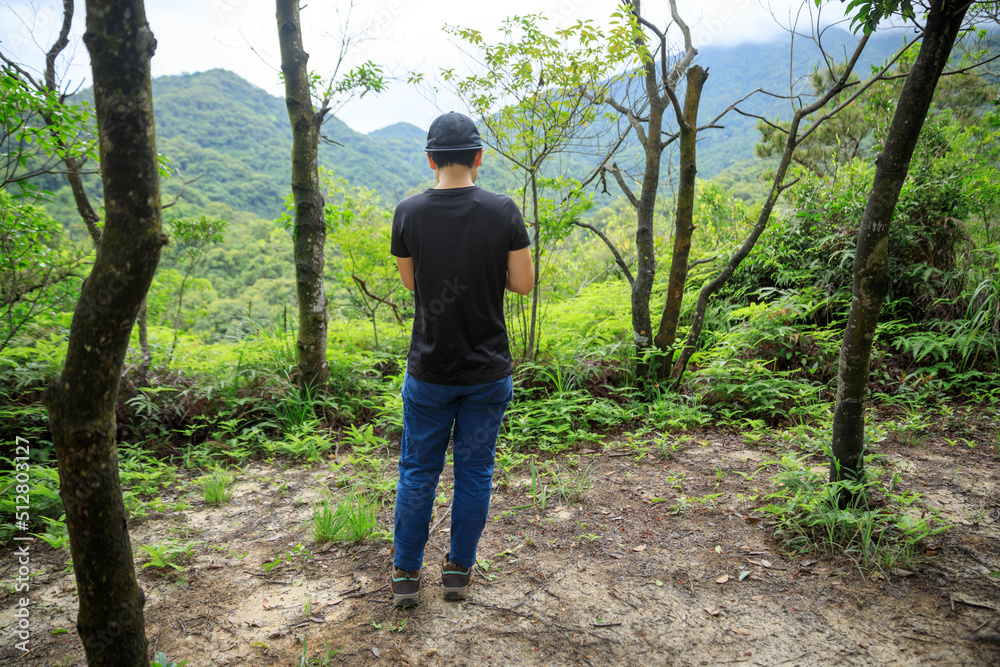 Fototapeta premium People remote control a flying drone in summer forest