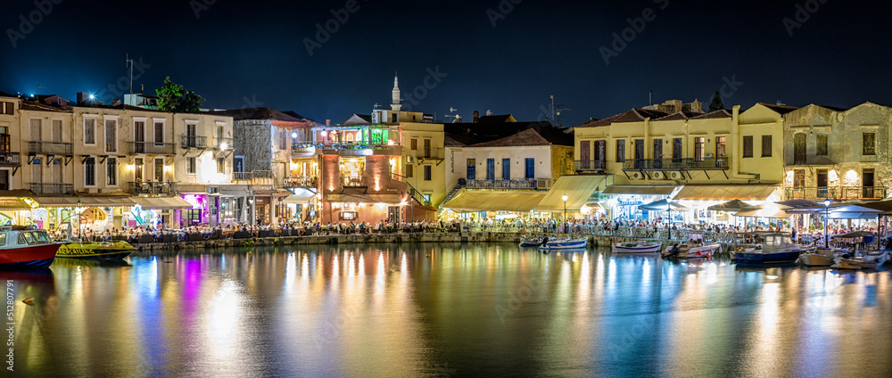 Terrace of restaurant full of people in port of  Rethymno city -Crete, Greece