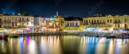 Terrace of restaurant full of people in port of  Rethymno city -Crete, Greece © Jaroslav Moravcik