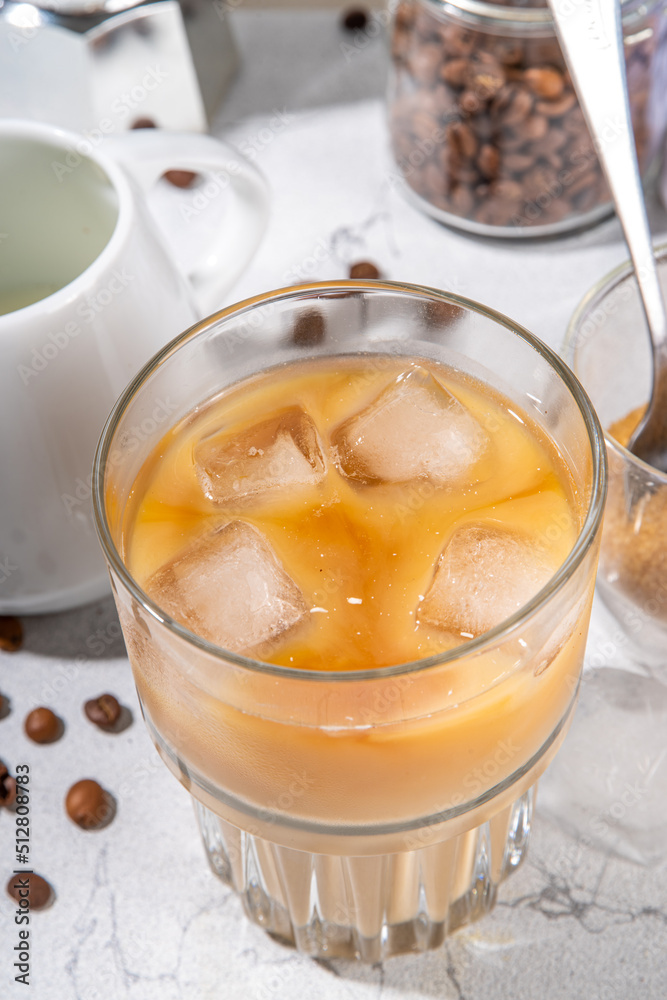Homemade iced latte coffee, with milk poured Into Iced coffee espresso, Summer cold refreshing drink concept Homemade iced latte coffee, with milk poured Into Iced coffee espresso, Summer cold refreshing drink concept