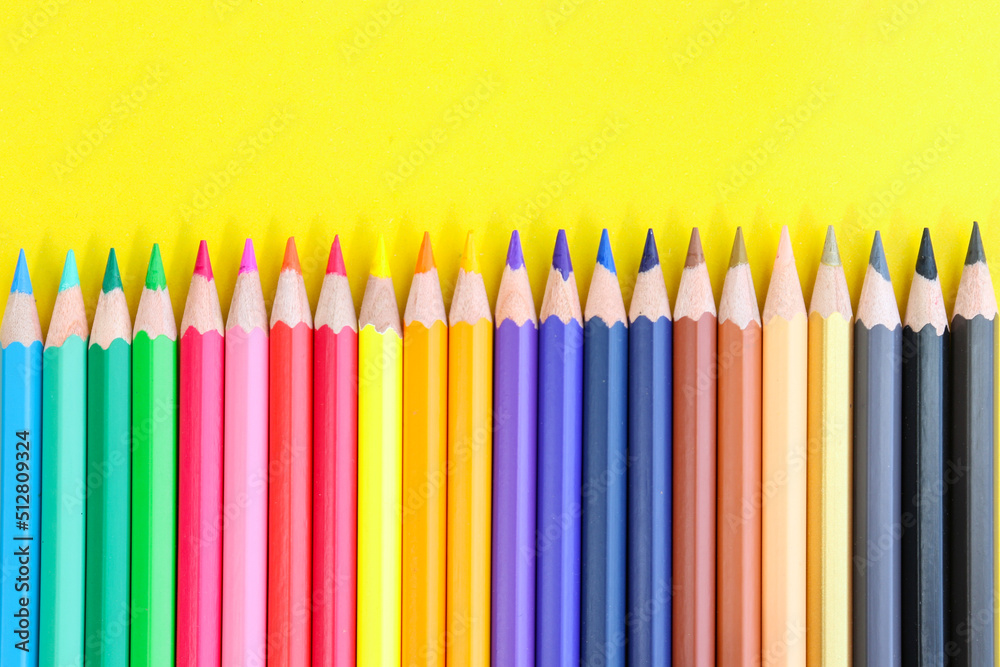 colored pencils with copy space on yellow background educational concept colored pencils with copy space on yellow background educational concept