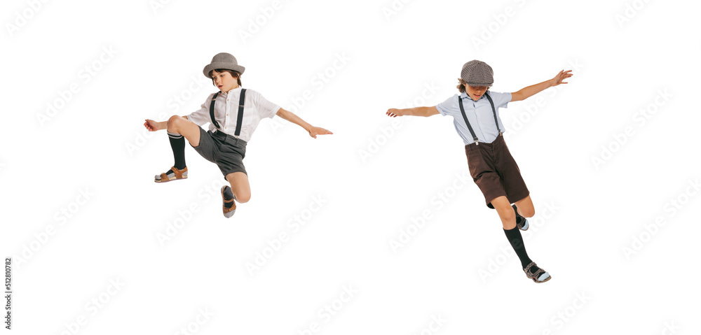 Cheerful little boys, stylish kids wearing retro clothes posing isolated over white background. Concept of childhood, vintage summer fashion style Cheerful little boys, stylish kids wearing retro clothes posing isolated over white background. Concept of childhood, vintage summer fashion style