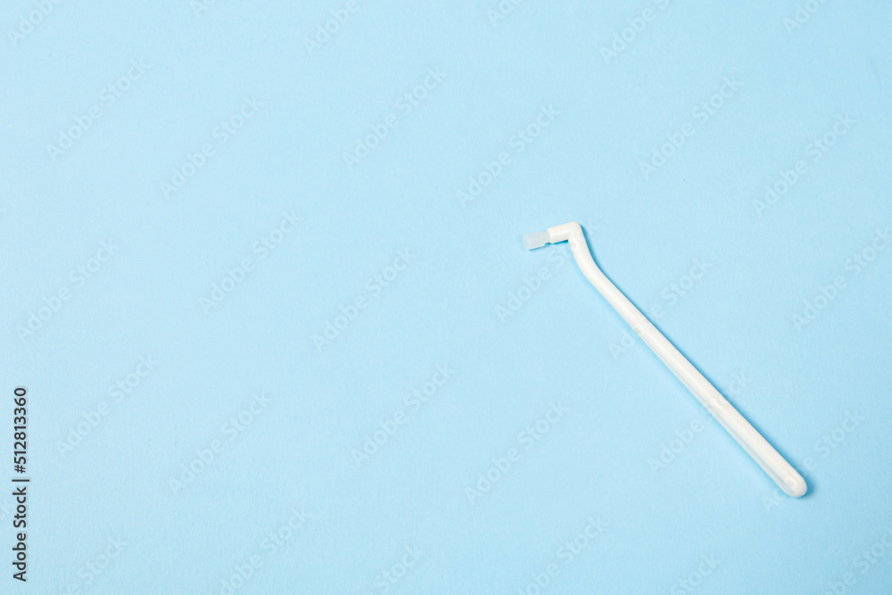 orthodontic toothbrush with one bundle for braces on a blue background special tool for oral care orthodontic toothbrush with one bundle for braces on a blue background special tool for oral care