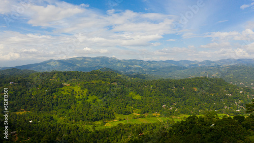 Mountain landscape  mountains with green forests and agricultural land with farm plantations. Sri Lanka.