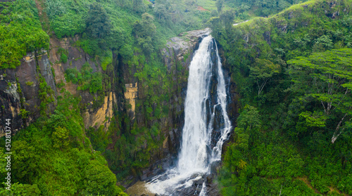 A beautiful waterfall among the rainforest and vegetation. Devon Falls, Sri Lanka.