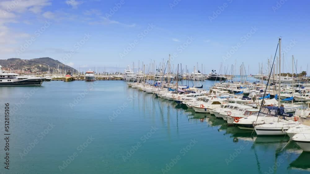 Aerial drone panoramic view of vieux port Porto Maurizio coastline in south Italy luxury marina yacht club rich ships docked sailboats in Liguria bay seaside european coastline from above in sunny day Aerial drone panoramic view of vieux port Porto Maurizio coastline in south Italy luxury marina yacht club rich ships docked sailboats in Liguria bay seaside european coastline from above in sunny day