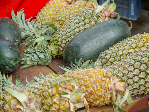 Pile of pinapples ready to be sold in a Indian local market photo