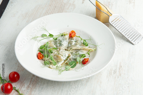 Ravioli in a plate decorated with herbs