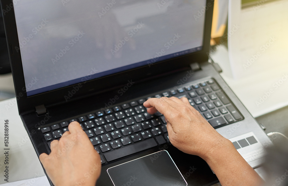 hands of person typing on a laptop hands of person typing on a laptop
