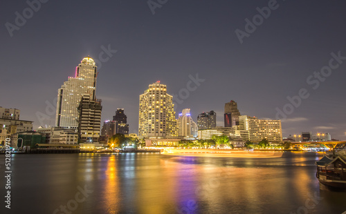 Klongsan,Bangkok,Thailand on February 18,2019:Beautiful night scene of Chao Phraya River and Bangkok skyline.  © mickey_41