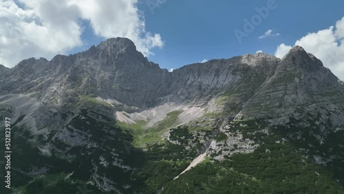 Hikers and travelers enjoying the beautiful mountain views as they have a mountain walk in the Dolomites Mountains, Italy. Active people in nature concept. photo