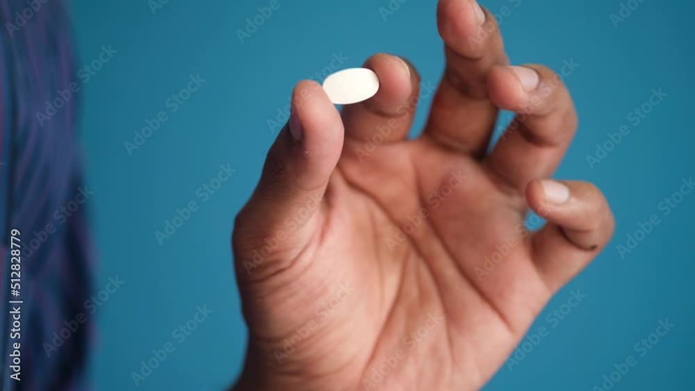 Close up of man hand holding pills with copy space Close up of man hand holding pills with copy space