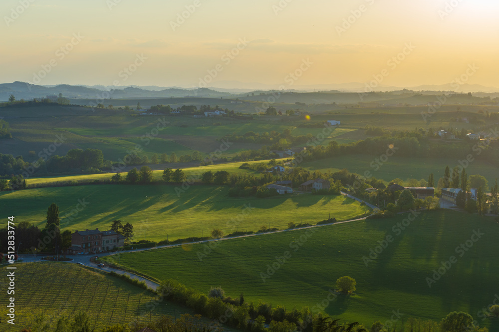 Fototapeta premium Landscape of the hills of Monferrato in Piedmont in Northern Italy at sunset time golden hour