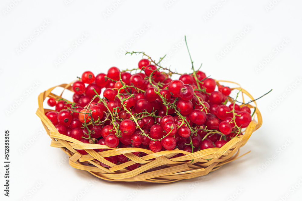 Redcurrant in a basket on a white background. Fresh ripe red currant. summer berry Redcurrant in a basket on a white background. Fresh ripe red currant. summer berry