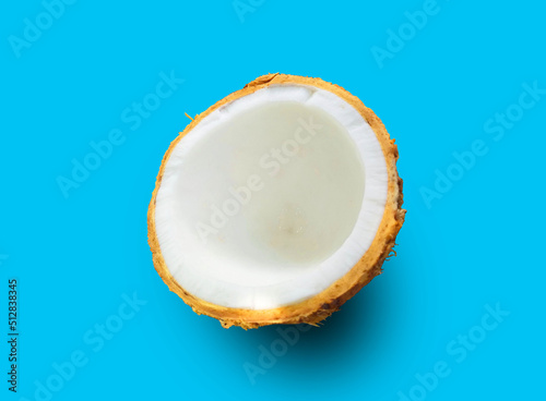 Top view, Half coconut isolated on cyan background, food and drink, condiment, dessert, ingredient