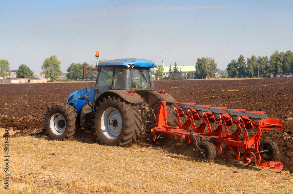 Obraz premium tractor with plough