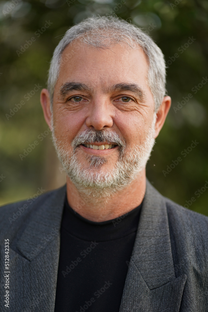 Senior professor in business suit smiling Senior professor in business suit smiling