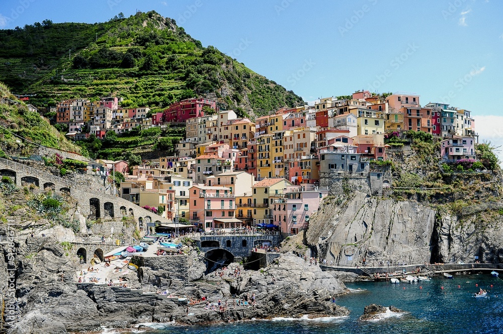Cinque Terre National Park surrounded by the sea under the sunlight in Italy