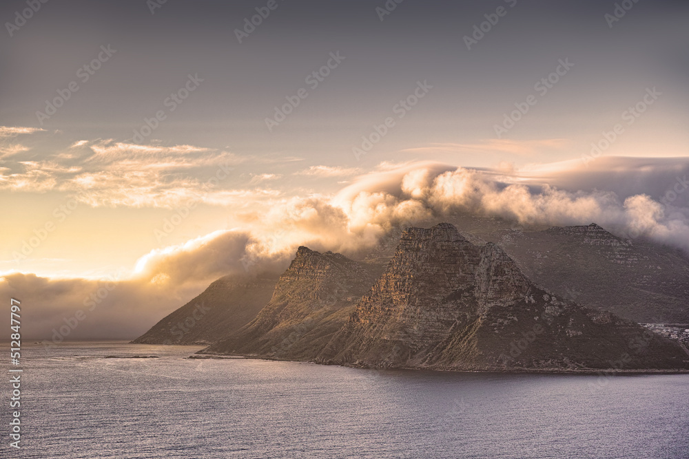Scenic landscape of mountains along the coast in Hout Bay, Cape Town, South Africa at sunset with cloudy sky and copyspace. Holiday destination for travel and tourism to explore nature and the wild